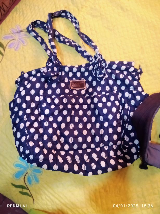 Bolso de maternidad y cargador